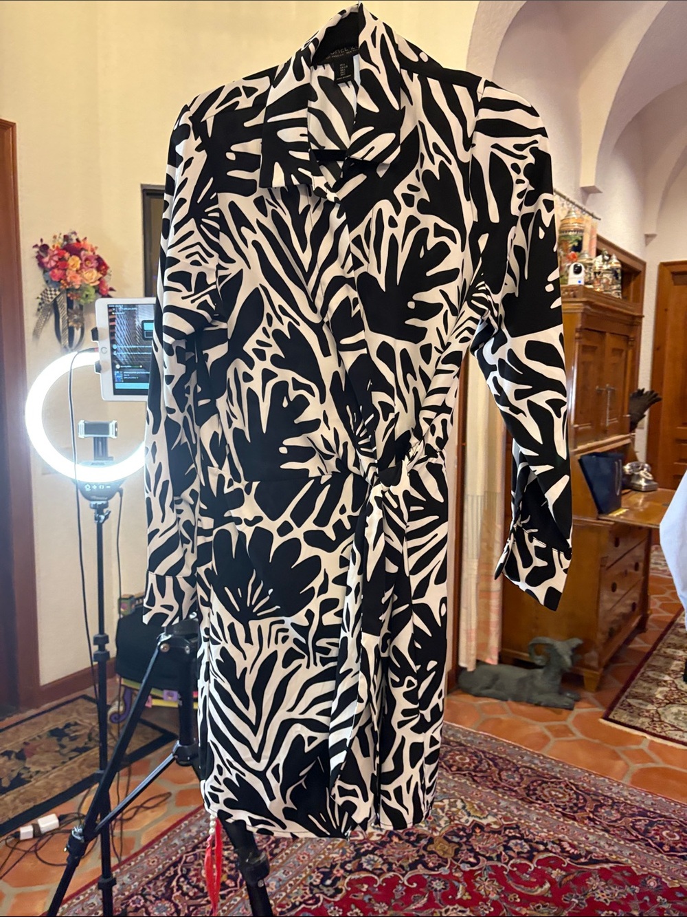 Black and white leaf print wrap style dress